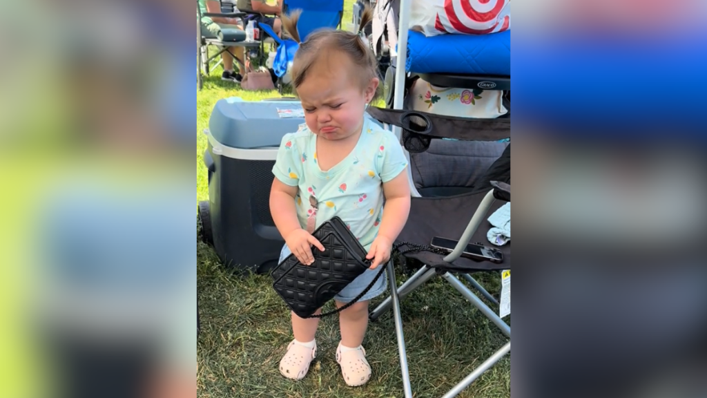 toddler crrying after her mom told her to put the purse down