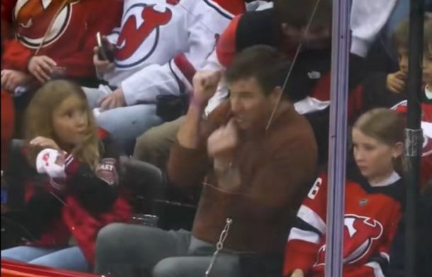 Eli Manning reflexively flinches after telling his daughters not to.