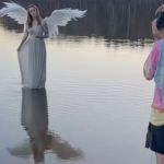 Image shows a photographer working with a model to create an inspiring angel photoshoot.