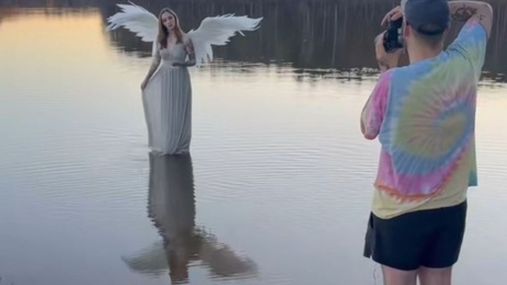 Image shows a photographer working with a model to create an inspiring angel photoshoot.
