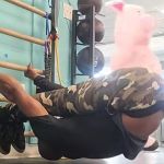 While recording a fitness video, a funny thing happened at the gym. A pig walked through his video.