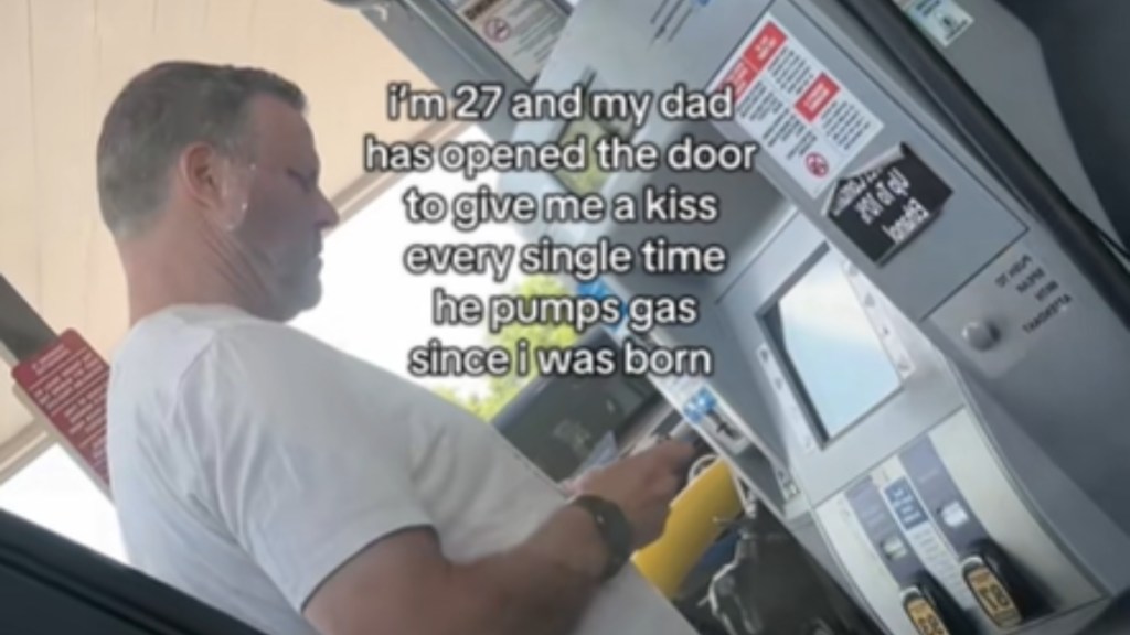 View from inside a car. A man stands at a gas station pump. Text on the image reads: "I'm 27 and my dad has opened the door to give me a kiss every single time he pumps gas since I was born"