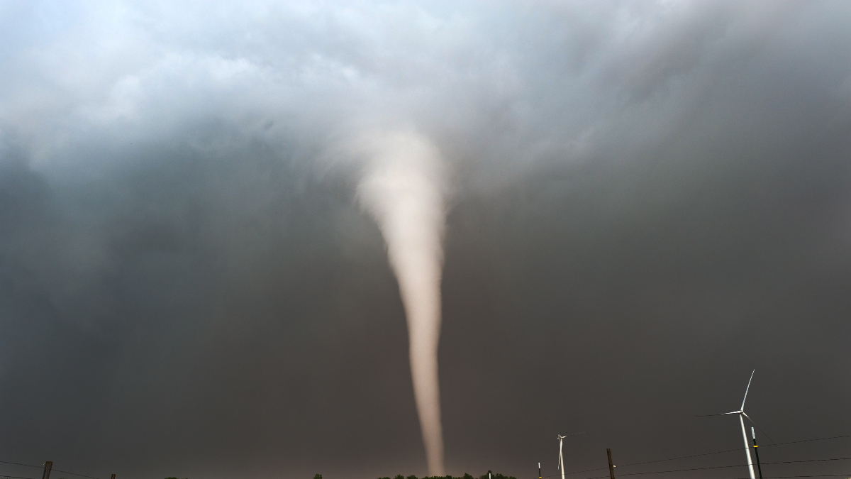Watch As A Tornado Forms Directly Under A Rainbow